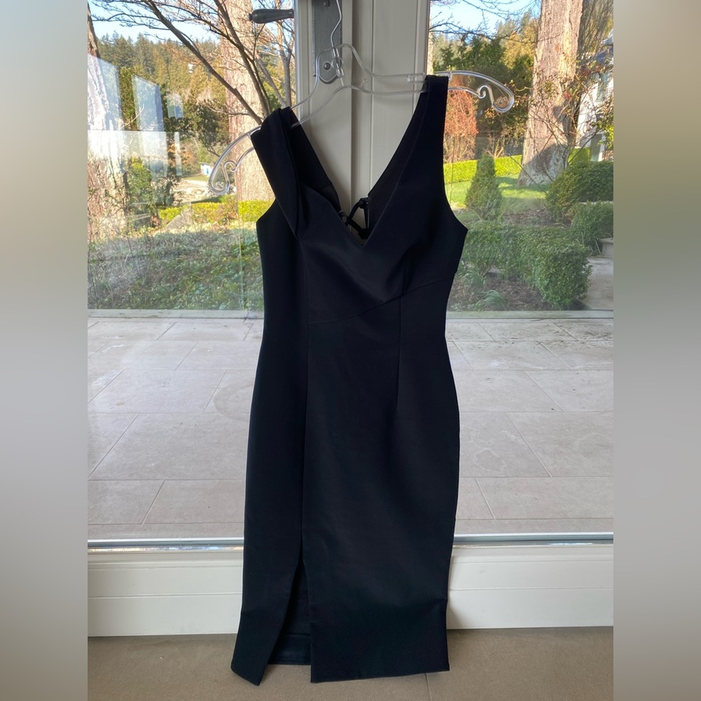 Black, formal pencil dress with lace up detailing on the back
